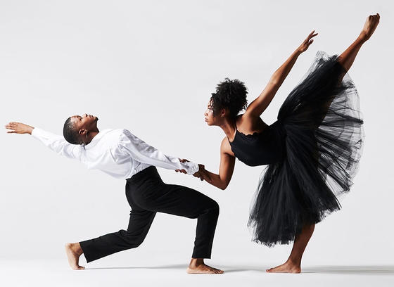 Mason Dance company dancers of color, dressed in white and black