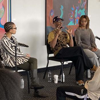 Dr. LaNitra Berger (left) with A.I.M artists, Donovan Reed (center) and 